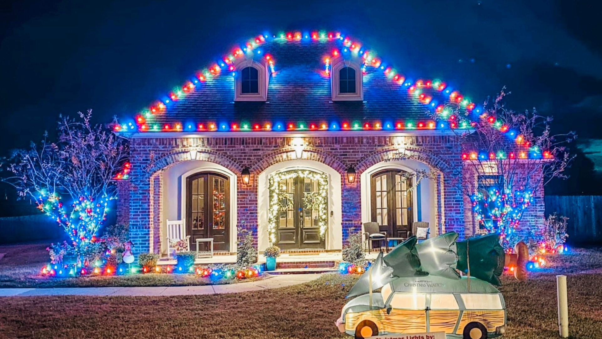Close-up of string lights installed on roofline for holiday decor